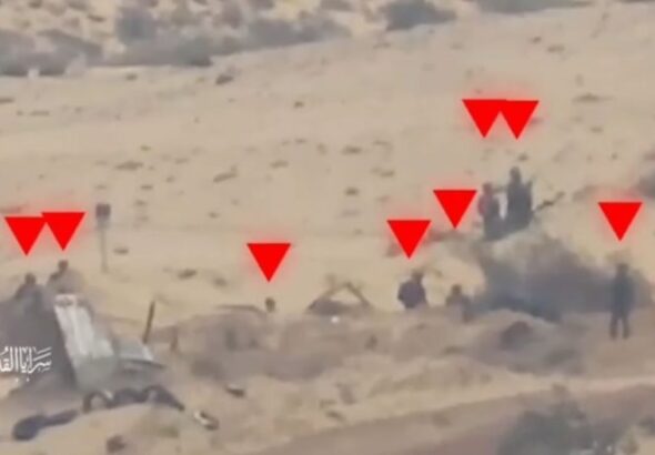 A screen grab from a video showing Palestinian Resistance fighters moments before engaging Israeli occupation soldiers amidst the battles in the Gaza Strip. Photo: Military Media of al-Quds Brigades.