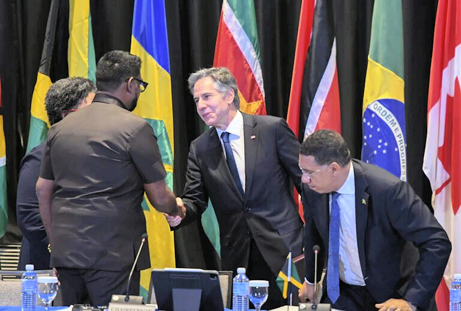 US Secretary of State Anthony Blinken thanking Guyanese President Irfaan Ali for a job well-done in fronting for the US-orchestrated “transitional presidential council” (CPT) in Haiti. Photo: Haïti Liberté.