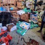 A UNRWA staff stands near a pool of blood at a UNRWA warehouse and distribution center in Rafah, in the southern Gaza strip, following an Israeli strike on March, 13, 2024. Photo: AFP.