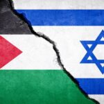 Photo composition showing the left side of a Palestinian flag (left) and the right side of an Israeli flag (right) divided by a wall crack. Photo: Stock image.