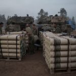 Israeli soldiers from the artillery unit store tank shells in a staging area in the Gaza envelope in southern occupied Palestine. January 1, 2024. Photo: AP.