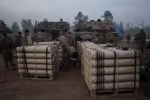 Israeli soldiers from the artillery unit store tank shells in a staging area in the Gaza envelope in southern occupied Palestine. January 1, 2024. Photo: AP.