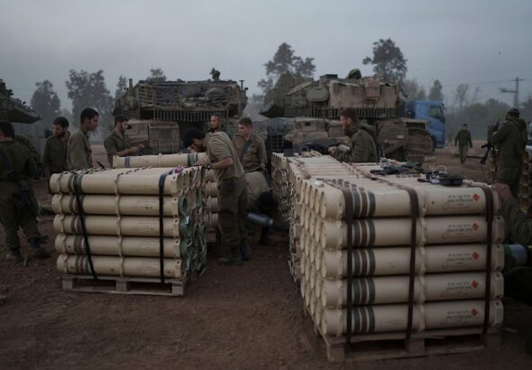 Israeli soldiers from the artillery unit store tank shells in a staging area in the Gaza envelope in southern occupied Palestine. January 1, 2024. Photo: AP.