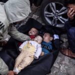 Bodies of the Palestinian children killed in an Israeli attack on a house belonging to the Sabit family are taken from the morgue of Al-Aqsa Martyrs Hospital by relatives for the funeral prayer in Deir al-Balah, Gaza, on March 17, 2024. Photo: Anadolu Agency.
