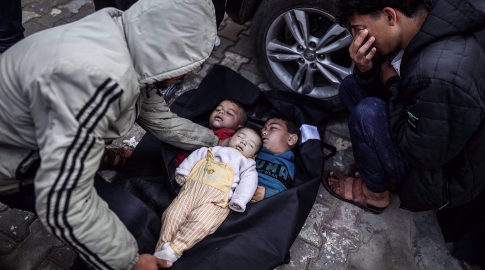 Bodies of the Palestinian children killed in an Israeli attack on a house belonging to the Sabit family are taken from the morgue of Al-Aqsa Martyrs Hospital by relatives for the funeral prayer in Deir al-Balah, Gaza, on March 17, 2024. Photo: Anadolu Agency.
