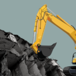 A bulldozer destroying a building. Photo. NewsClick/File Photo.
