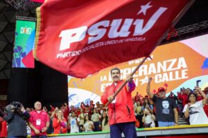 Venezuelan President Nicolás Maduro waves the PSUV flag during the 5th PSUV Congress where he was proclaimed as the party's presidential candidate for the 2024 presidential elections. Photo: X/@NicolasMaduro.