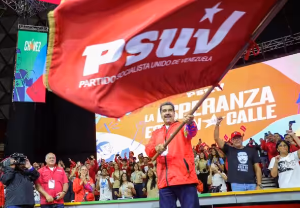 Venezuelan President Nicolás Maduro waves the PSUV flag during the 5th PSUV Congress where he was proclaimed as the party's presidential candidate for the 2024 presidential elections. Photo: X/@NicolasMaduro.