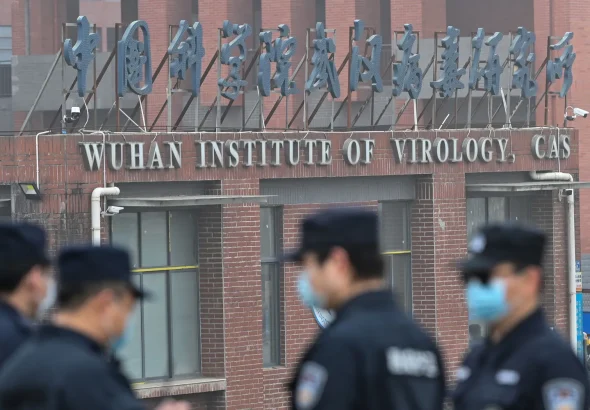 Security personnel stand guard outside the Wuhan Institute of Virology in China, February 3, 2021. Photo: Hector Retamal/AFP/Getty Images.