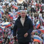 Russian President Vladimir Putin attends a concert marking the eighth anniversary of Russia's incorporation of Crimea at the Luzhniki stadium in Moscow on March 18, 2022. Photo: Getty Images/File photo.