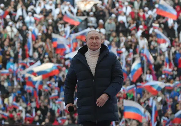 Russian President Vladimir Putin attends a concert marking the eighth anniversary of Russia's incorporation of Crimea at the Luzhniki stadium in Moscow on March 18, 2022. Photo: Getty Images/File photo.