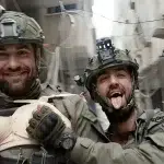 Israeli occupation army soldiers pose with Palestinian women's lingerie looted from Palestinian people's homes in Gaza. Photo: Social media.