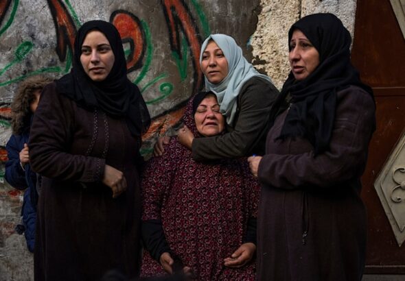 Palestinian women react after their home was hit by an Israeli airstrike in Rafah, southern Gaza Strip, February 8, 2024. Photo: AP.