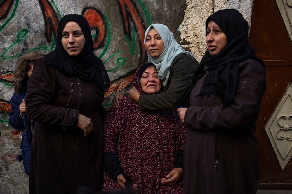 Palestinian women react after their home was hit by an Israeli airstrike in Rafah, southern Gaza Strip, February 8, 2024. Photo: AP.