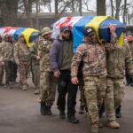 Georgian Legion mercenaries carry coffins of Ukrainian soldiers who died in a battle against Russian troops, during a funeral ceremony in Kiev, March 12, 2024. Photo: AP.