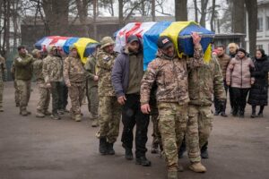 Georgian Legion mercenaries carry coffins of Ukrainian soldiers who died in a battle against Russian troops, during a funeral ceremony in Kiev, March 12, 2024. Photo: AP.