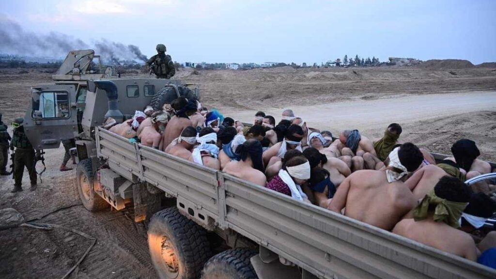 Half naked Gazans taken hostage in the back of a truck by IOF "soldiers." Photo: X.