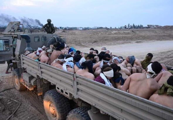Half naked Gazans taken hostage in the back of a truck by IOF "soldiers." Photo: X.