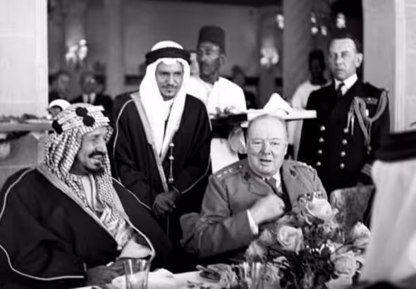 Winston Churchill sits with King Abdulaziz Ibn Saud of Saudi Arabia during lunch at Auberge due Lac, Fayoum, in February 1945. Photo: AP/File photo. 