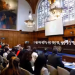 Judges and delegates sit in the courtroom as Nicaragua is set to ask the International Court of Justice on Monday to order Berlin to halt military arms exports to Israel and reverse its decision to stop funding UN Palestinian refugee agency UNRWA, in The Hague, Netherlands, April 8, 2024. Photo: Reuters.