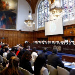 Judges and delegates sit in the courtroom as Nicaragua is set to ask the International Court of Justice on Monday to order Berlin to halt military arms exports to Israel and reverse its decision to stop funding UN Palestinian refugee agency UNRWA, in The Hague, Netherlands, April 8, 2024. Photo: Reuters.