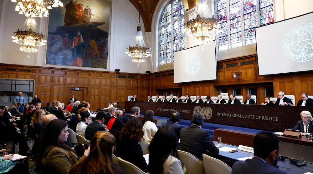 Judges and delegates sit in the courtroom as Nicaragua is set to ask the International Court of Justice on Monday to order Berlin to halt military arms exports to Israel and reverse its decision to stop funding UN Palestinian refugee agency UNRWA, in The Hague, Netherlands, April 8, 2024. Photo: Reuters.