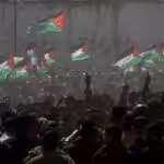 Palestinian demonstrators wave Palestine’s flags during a rally marking Land Day in Beit Hanoun, in the northern Gaza Strip, Palestine, March 30, 2012. Photo: AP.