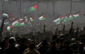Palestinian demonstrators wave Palestine’s flags during a rally marking Land Day in Beit Hanoun, in the northern Gaza Strip, Palestine, March 30, 2012. Photo: AP.