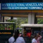 A banner with a message that reads in Spanish: "Venezuelan electoral power, safe and reliable voting guaranteed," is displayed on the facade of the National Electoral Council, in Caracas, Venezuela, Thursday, March 21, 2024. Photo: Ariana Cubillos/AP.