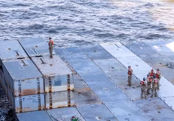 US Army soldiers prepare mobile causeway sections to be loaded aboard MV Roy A. Benavidez on March 15, 2024. Photo: USNI News.