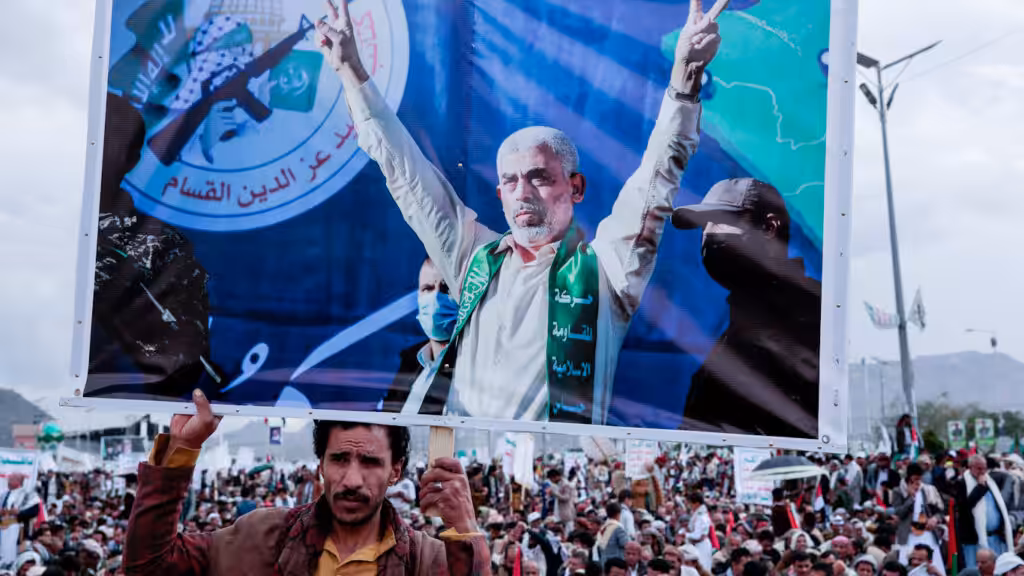 A Yemeni man holds a poster of Yahya Sinwar, head of Hamas, during a protest marking Quds Day in support of Palestinians in Gaza, Sanaa, Yemen, April 05, 2024. Photo: Osamah Abdulrahman/AP.