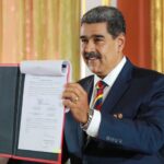Venezuelan President Nicolás Maduro shows the just signed Organic Law for the Defense of Guyana Esequiba at the Venezuelan parliament, April 3, 2024. Photo: X/@delcyrodriguezv.