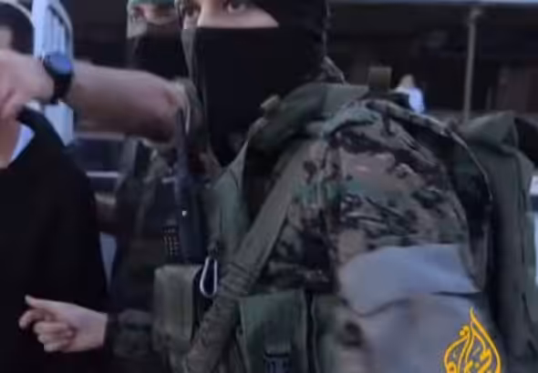 Members of Hamas armed wing Al-Qassam Brigades during the prisoner exchange with Israel in November 2023. Photo: Screenshot of video circulated by Al Jazeera.