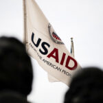 USAID flag flies in front of the USAID headquarters in Washington, DC, as seen on September 10, 2019. Photo: Graeme Sloan/Sipa USA.