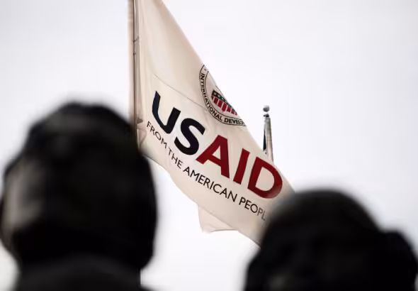 USAID flag flies in front of the USAID headquarters in Washington, DC, as seen on September 10, 2019. Photo: Graeme Sloan/Sipa USA.