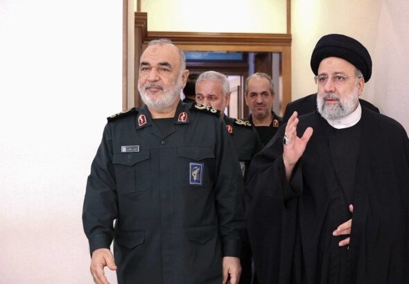 Iranian President Ebrahim Raisi (right) and Commander-in-chief of the Army of the Guardians of the Islamic Revolution Hossein Salami (left) walking together. Photo: Iranian Presidency.