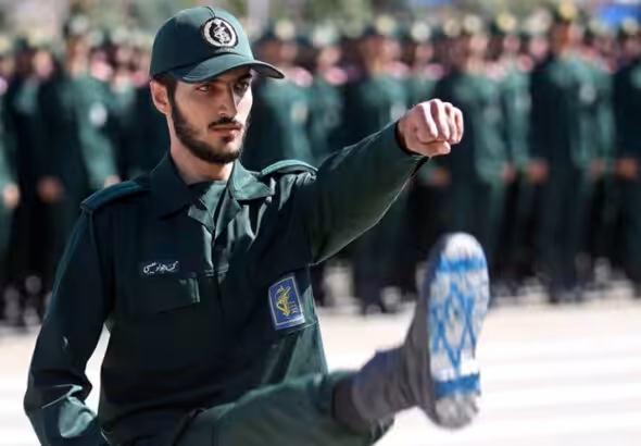An Iranian Revolutionary Guard officer, with the Israeli flag drawn on his boots, is seen during the graduation ceremony, held for military cadets at a military academy, in Tehran, Iran, June 30, 2018. Photo: Reuters.