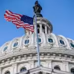 A US flag waves next to the US Congress Capitol Building in Washington, DC. Photo: AFP/File photo.