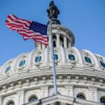 A US flag waves next to the US Congress Capitol Building in Washington, DC. Photo: AFP/File photo.