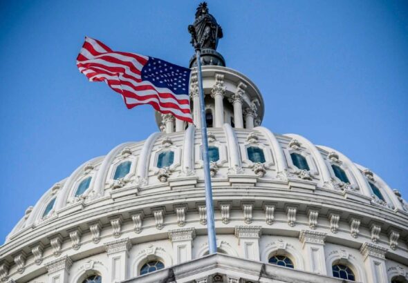 A US flag waves next to the US Congress Capitol Building in Washington, DC. Photo: AFP/File photo.