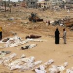 People gather near bodies lined up for identification after they were unearthed from a mass grave found in the Nasser Medical Complex in the southern Gaza Strip. Photo: AFP.