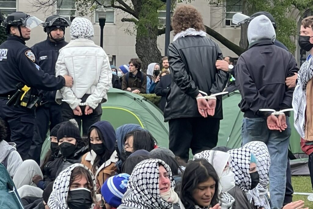 Featured image: Students being arrested in the United States for protesting against Israel’s genocide on Palestinians. Photo: X/@ShayoniMitra.