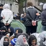 Featured image: Students being arrested in the United States for protesting against Israel’s genocide on Palestinians. Photo: X/@ShayoniMitra.