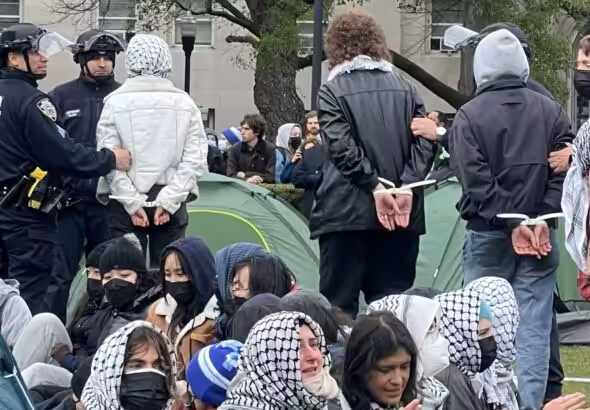 Featured image: Students being arrested in the United States for protesting against Israel’s genocide on Palestinians. Photo: X/@ShayoniMitra.