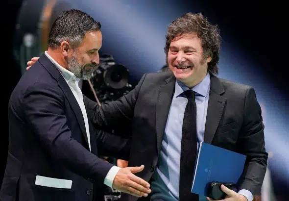 Spanish far-right Vox party leader Santiago Abascal greets Argentina's President Javier Milei during the rally where Milei insulted Spain's Prime Minister Pedro Sanchez. Madrid, Spain,  May 19, 2024. Photo: Ana Beltran/Reuters.