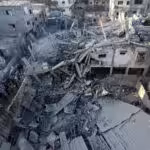 Destroyed buildings caused by Israeli bombing on the Zuwaida area in the central Gaza Strip. Photo: AFP.