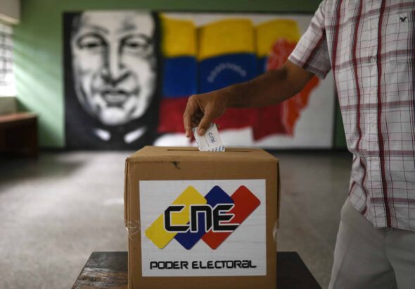 A man participates in a mock election in Caracas, Venezuela, on October 25, 2020. Photo: Matias Delacroix/AP.
