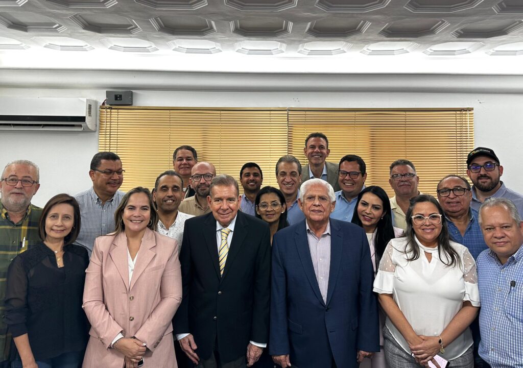 Edmundo Gonzales Urrutia (front row in black suit) next to Omar Barboza (grey suit), head of the Venezuelan far-right Unitary Platform. Photo: X/@Polianalitica.