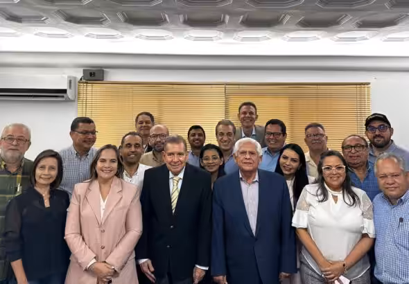 Edmundo Gonzales Urrutia (front row in black suit) next to Omar Barboza (grey suit), head of the Venezuelan far-right Unitary Platform. Photo: X/@Polianalitica.