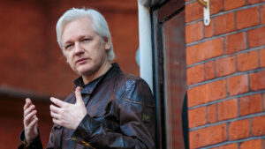 Julian Assange on the balcony of the Ecuadorian Embassy in London in 2017. Photo: Jack Taylor/Getty Images.